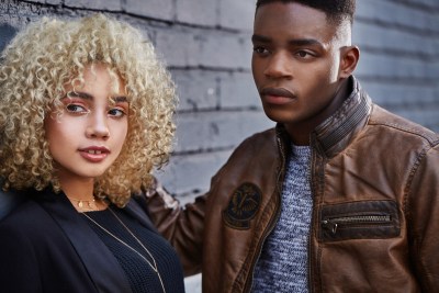 Editorial portrait of a couple, the woman in glitter makeup. By Nick van der Touw.