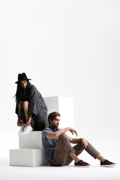 Studio lookbook frame of a woman in a patterned outfit and hat. By Nick van der Touw.