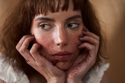Beauty close-up of Franchesca with jam used as styling across the skin. Editorial by Nick van der Touw.