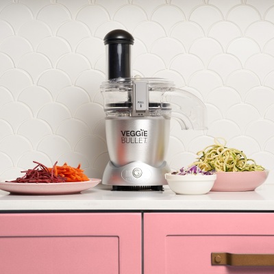 Product shot of a food spiraliser with prepared vegetables. By Nick van der Touw.