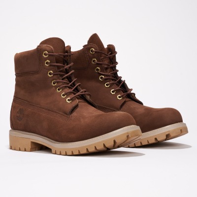 Product shot of brown nubuck work boots. By Nick van der Touw.