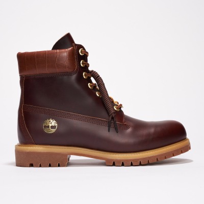 Product shot of dark brown leather work boots. By Nick van der Touw.