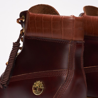 Close-up product shot of a brown leather boot. By Nick van der Touw.