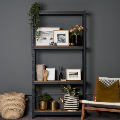 Homeware scene with a styled black shelving unit and decor. By Nick van der Touw.