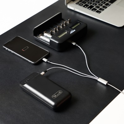 Product shot of a phone with a multi-charging cable. By Nick van der Touw.