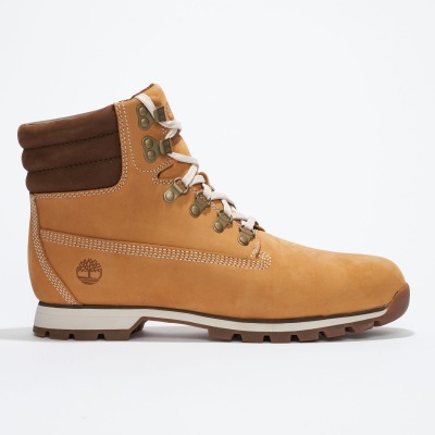 Product shot of a wheat nubuck lace-up boot on white. By Nick van der Touw.
