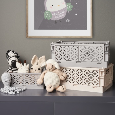 Product shot of woven storage baskets with toys. By Nick van der Touw.