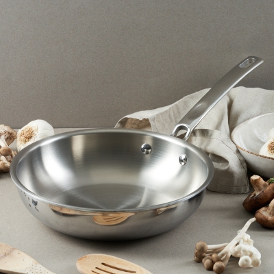 Product shot of a Balzano stainless saucepan with vegetables. By Nick van der Touw.