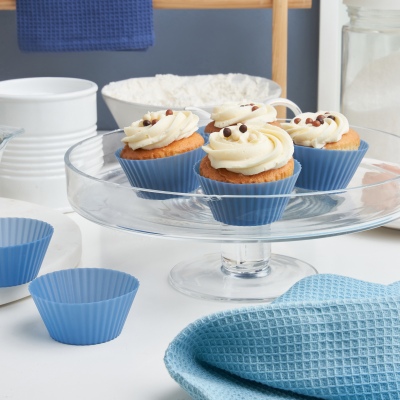 Baking shot of cupcakes on a glass cake stand. By Nick van der Touw.