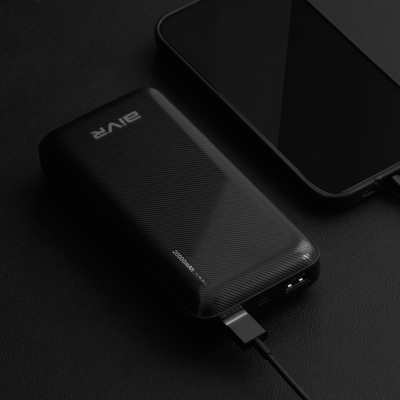 Product shot of a black power bank. By Nick van der Touw.