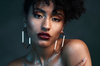 Beauty editorial of Luana with water running across the face. Studio photography by Nick van der Touw.