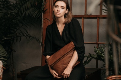 Woodstock Leather 2021 campaign accessory frame featuring a clutch bag. By Nick van der Touw.