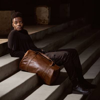 Woodstock Leather 2020 campaign frame on a staircase. Fashion photography by Nick van der Touw.